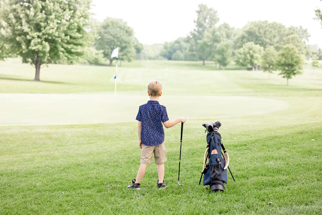 junior golf club set with kid