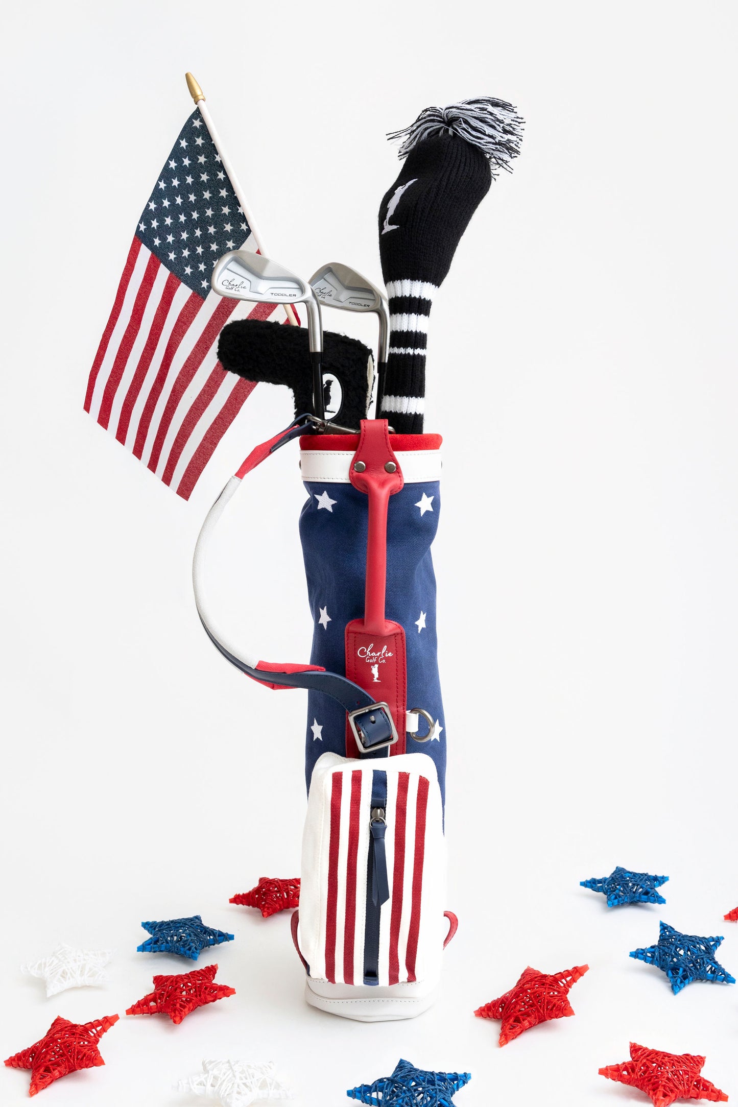 kid Golf club set in a patriotic toddler golf bag with American flag design on a white background