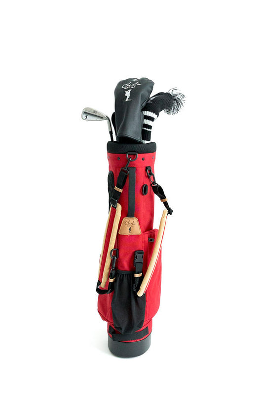 red junior golf bag with junior golf clubs
