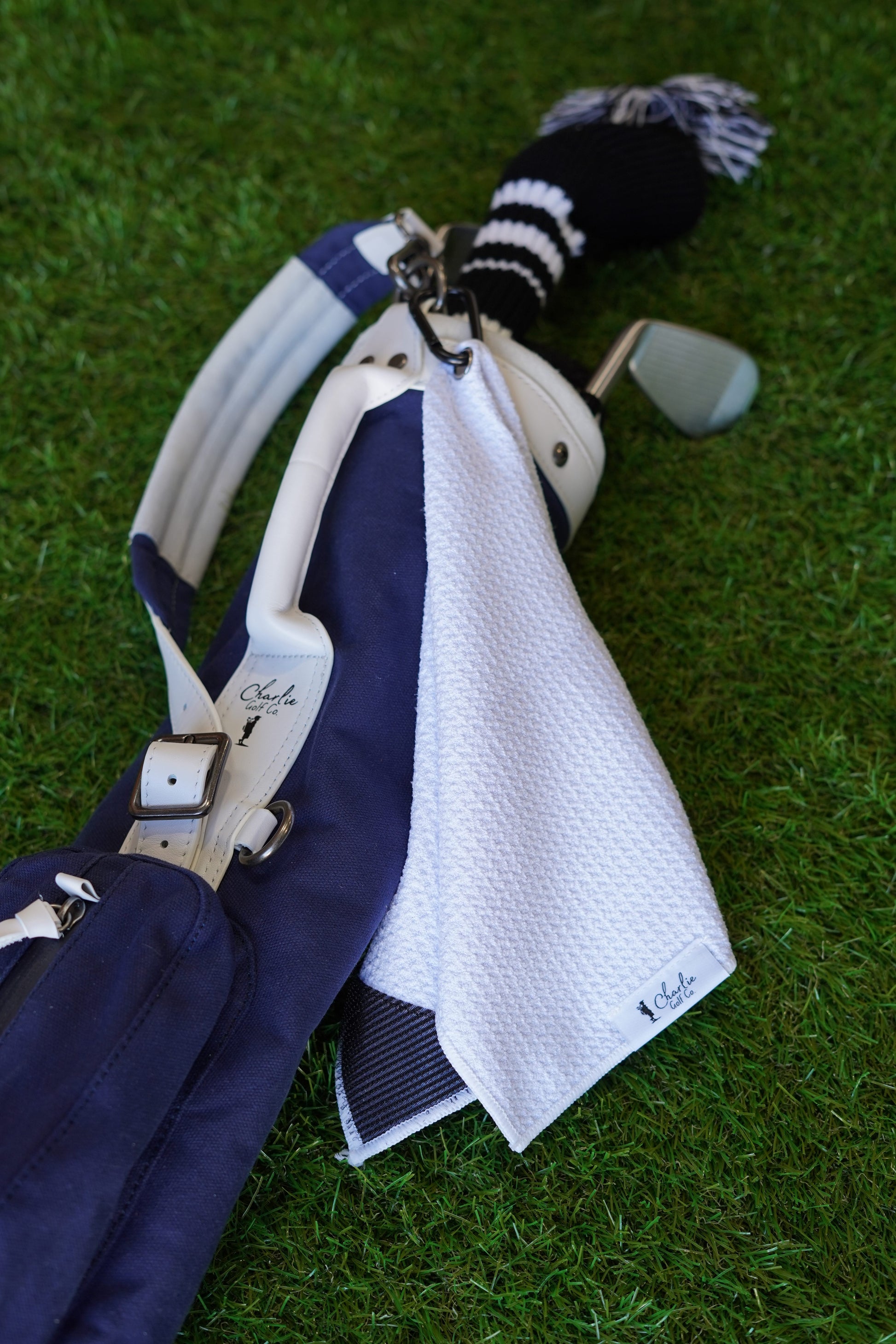 kids golf clubs with white golf towel for kids