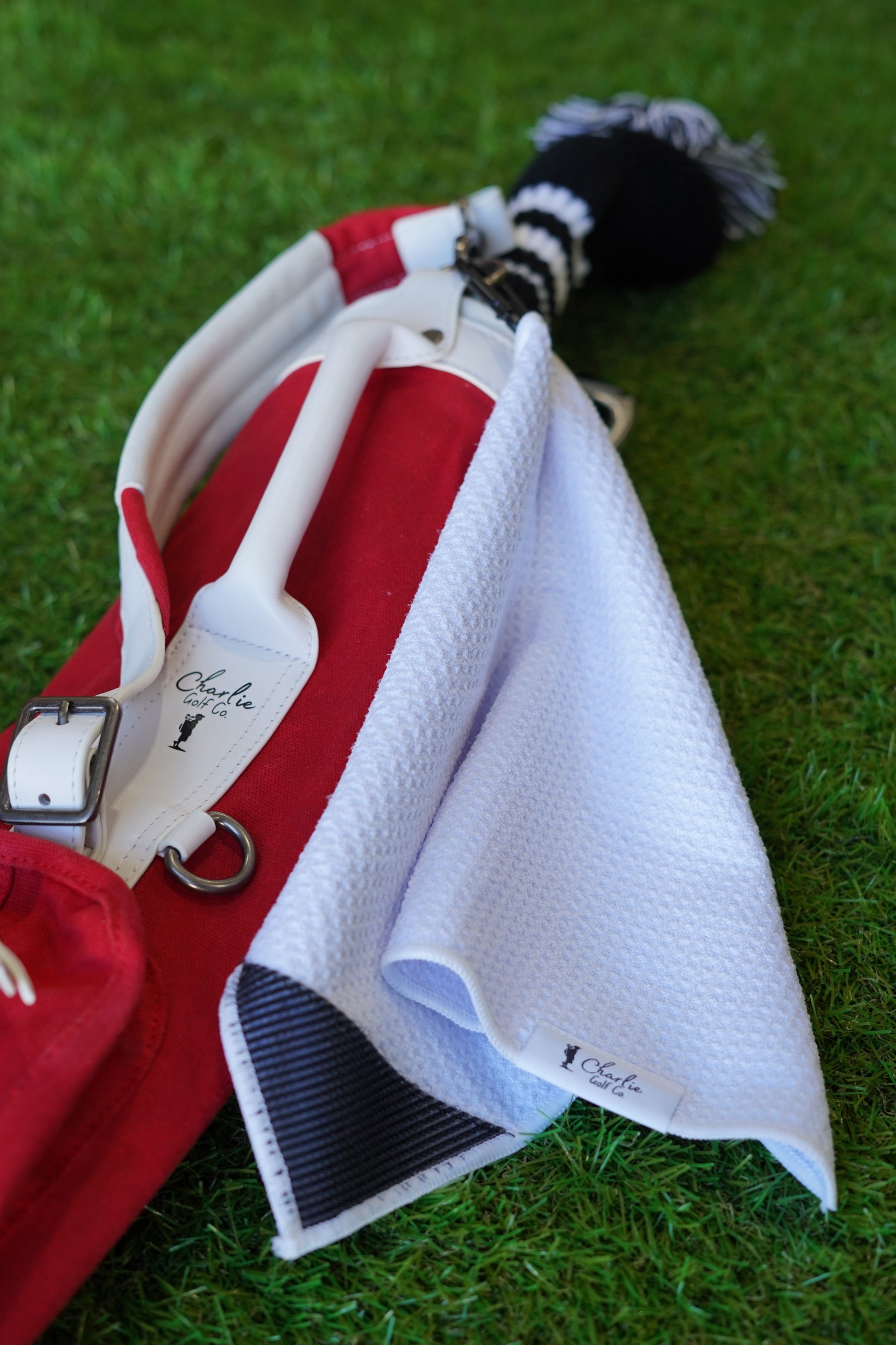 red toddler golf bag with white kids golf towel