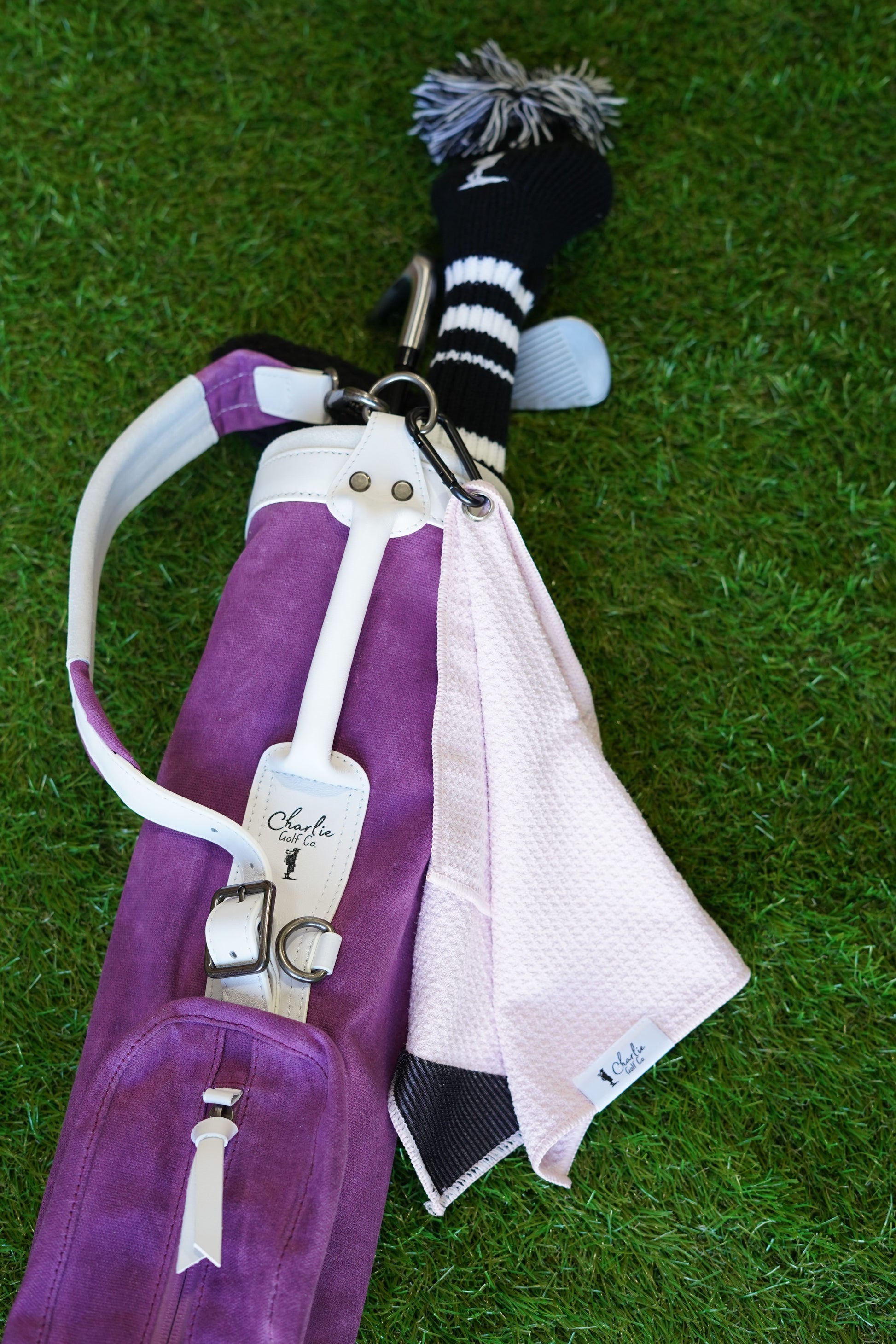 pink kids golf towel with kids golf clubs