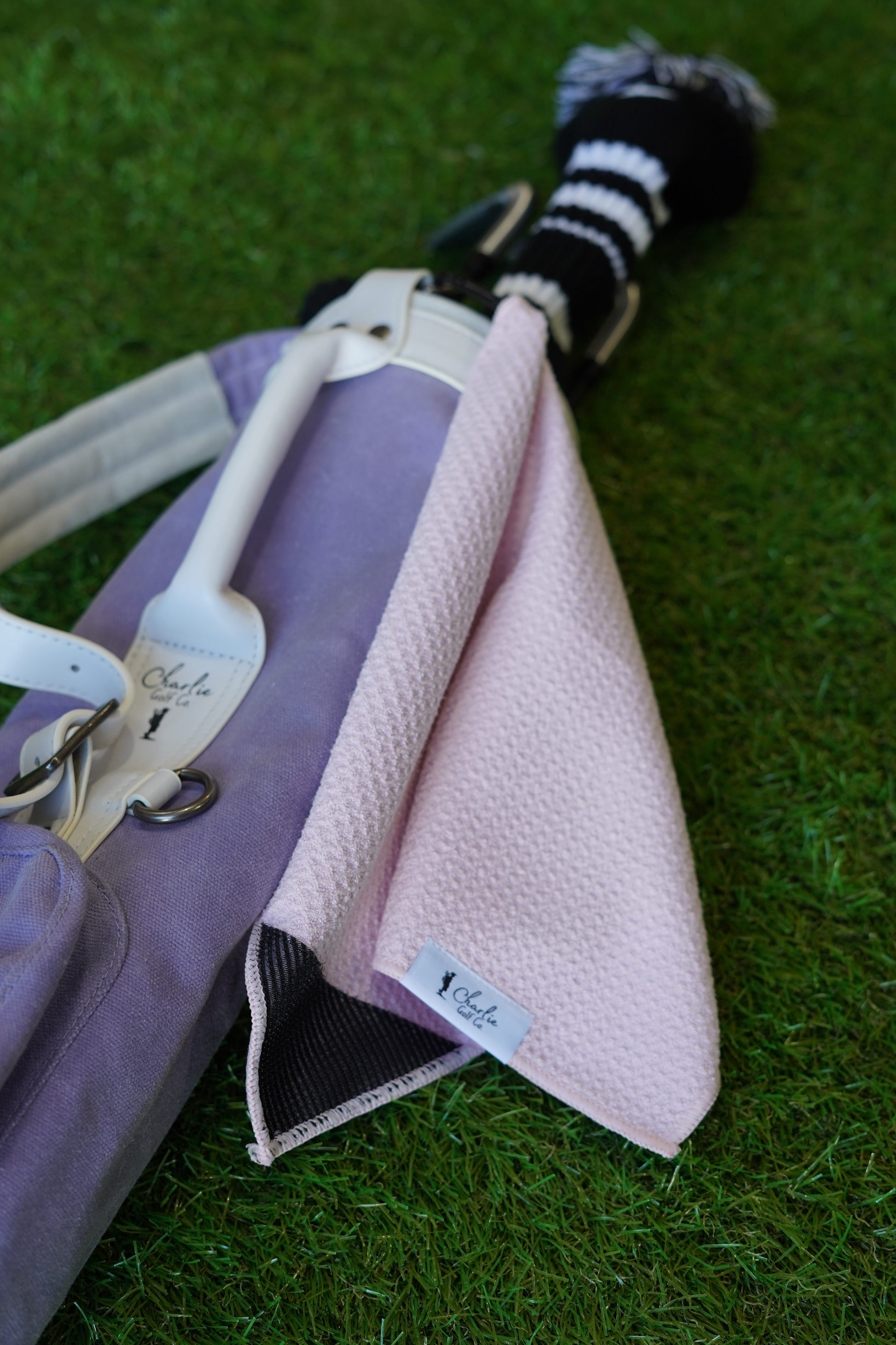 purple golf bag with pink kids golf towel