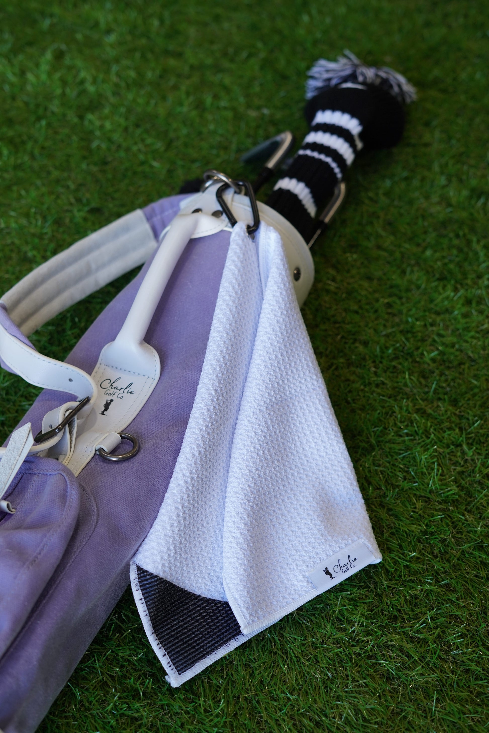 purple toddler golf bag and kids golf clubs with white kids golf towel
