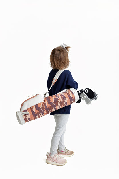 girl with pink camo toddler golf bag and clubs