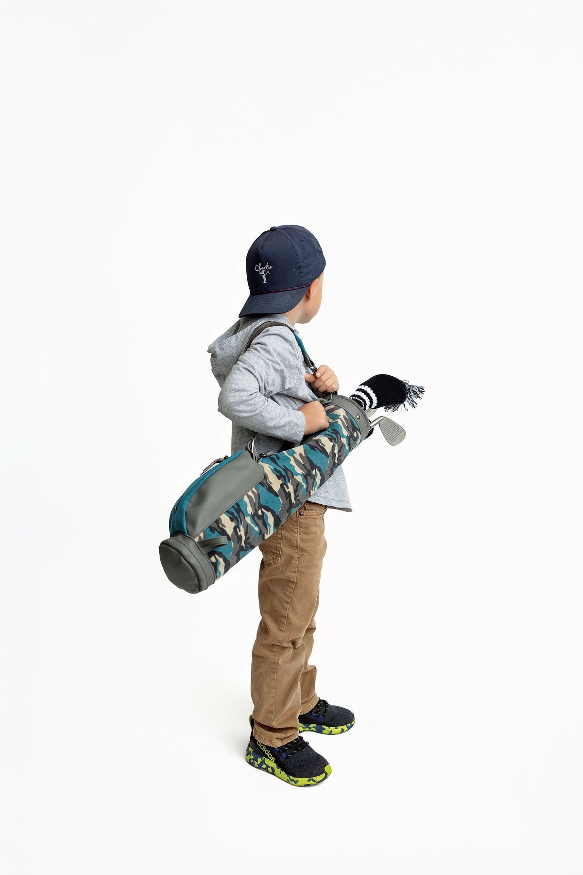 kid carrying blue camo toddler golf set