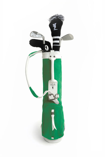 toddler golf clubs in a green kids golf bag