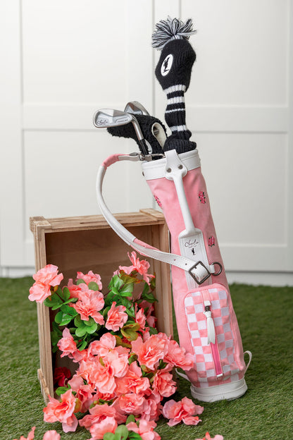 toddler golf clubs inside of a toddler golf bag 