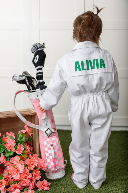 child golf bag with girl holding complete toddler golf set