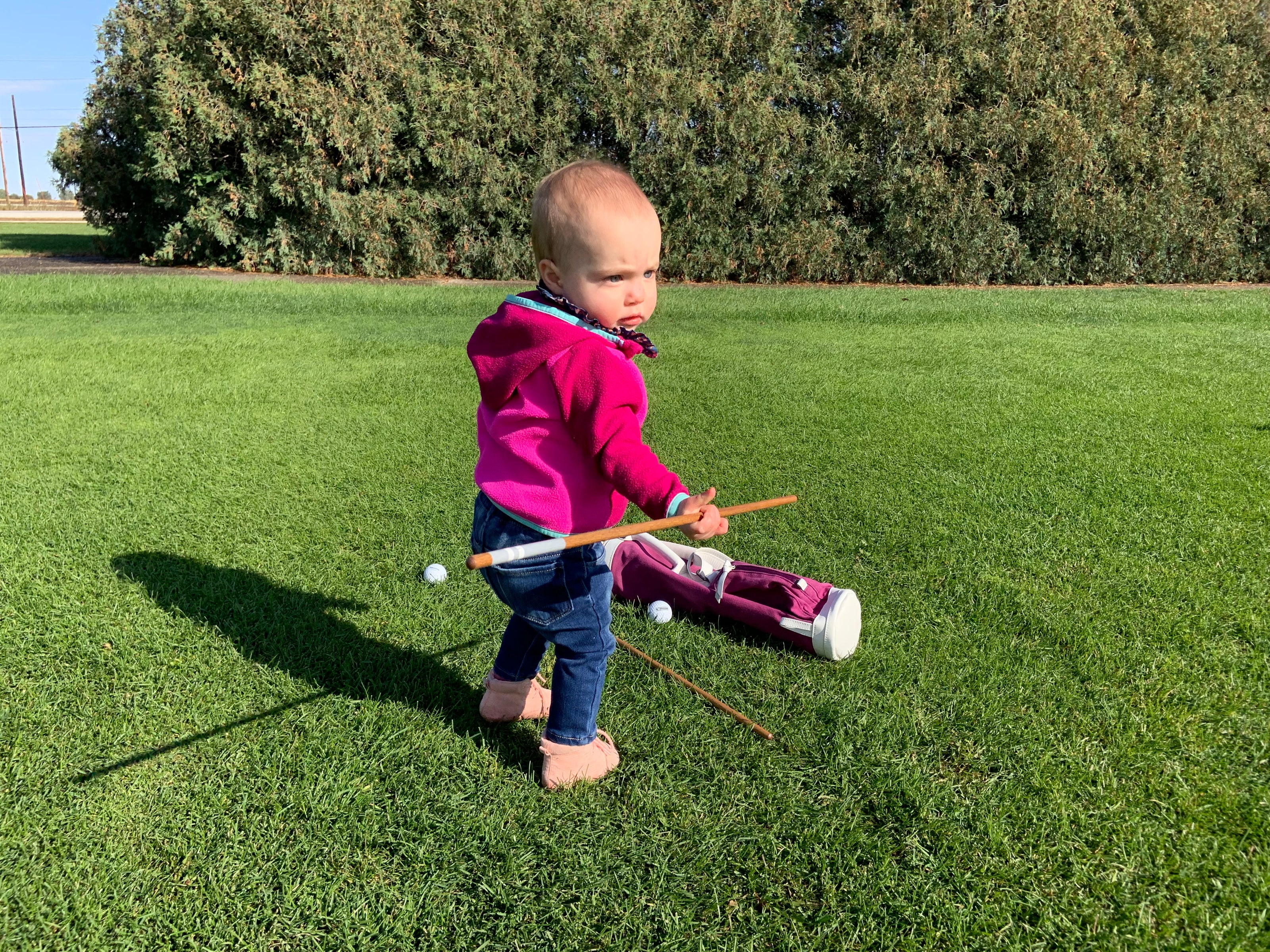 kid playing on driving range