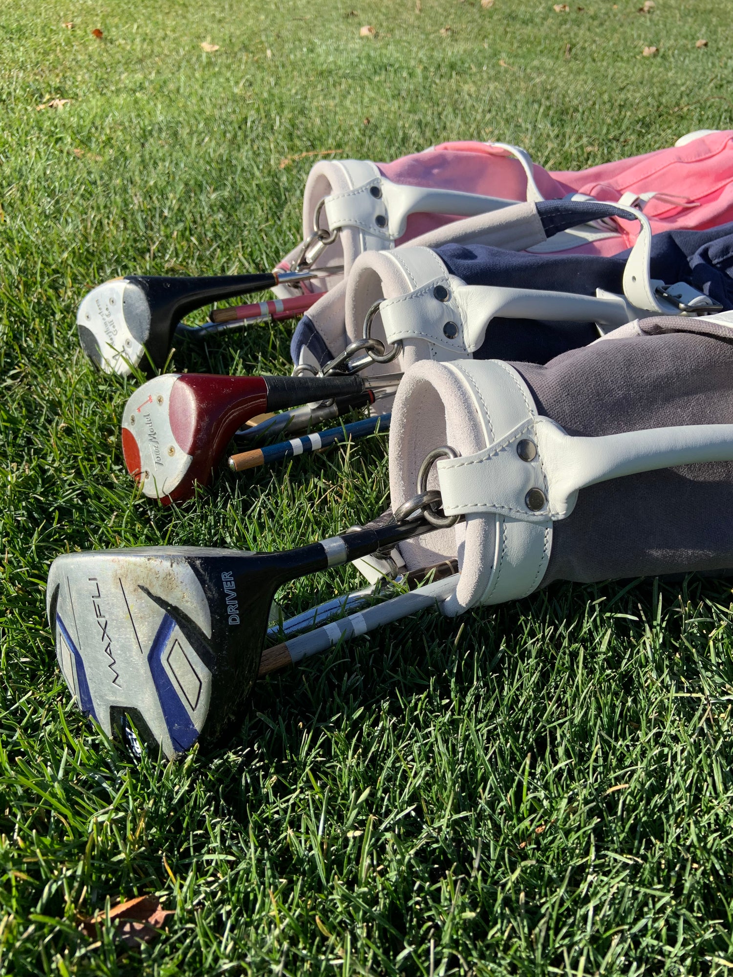 kids golf clubs in a kids golf bag