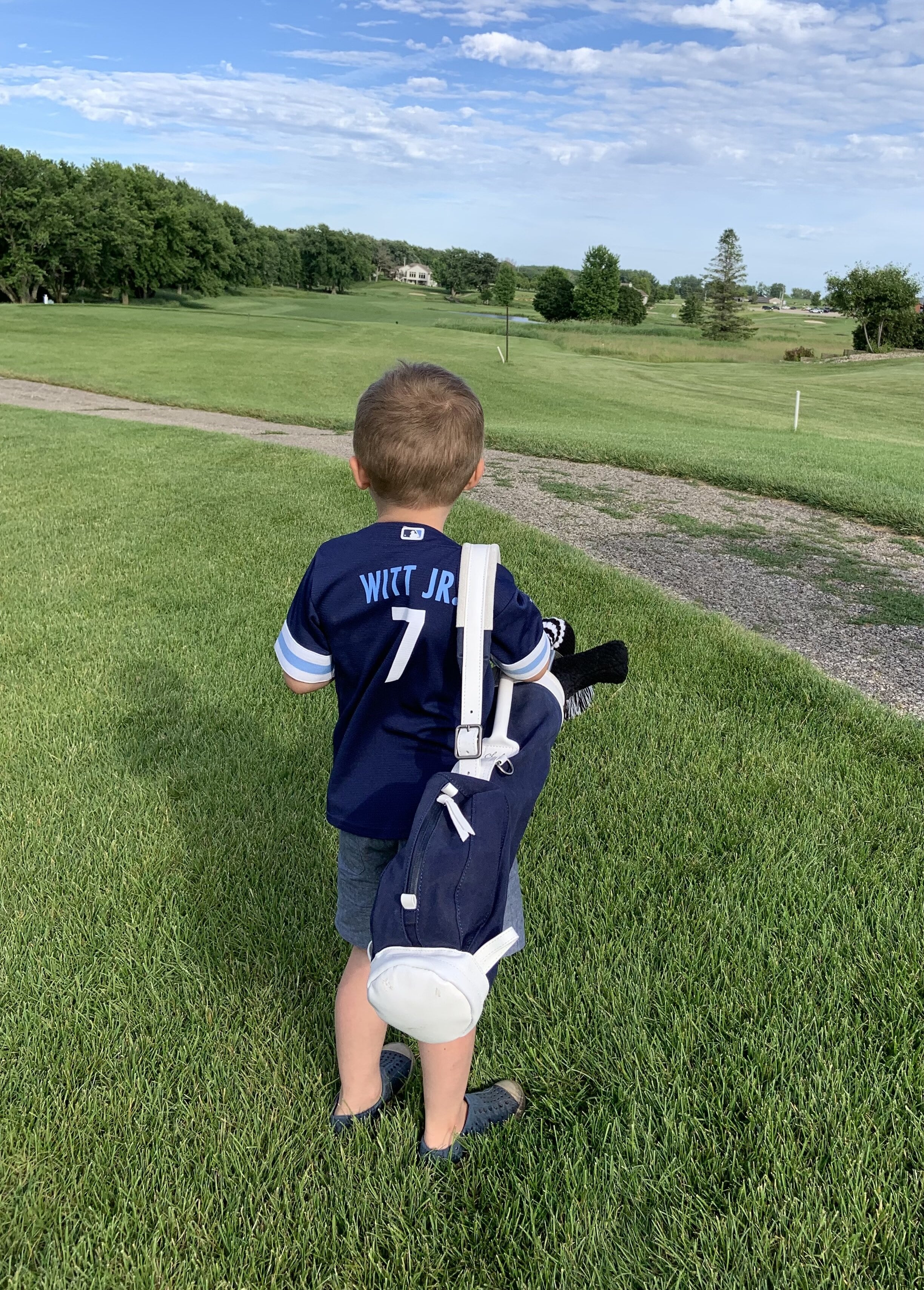 Kids golf set carried by a toddler