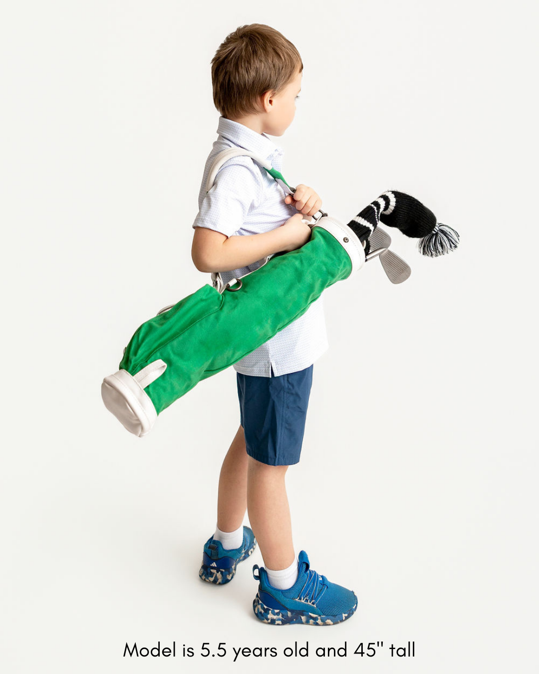 Green toddler golf bag with youth golf clubs